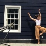 Lily Mollicone dancing outside against a house, window, hammock