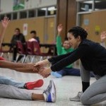 Student from JUNTOS NYC Membership program teaching a community outreach dance class. 