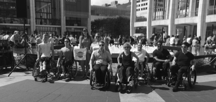 Black and White Photo - Group of wheelchair users in front of the fountain at Lincoln Center