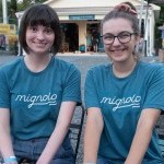 Mignolo interns seated at ticket booth at Mignolo Arts Grand Opening Gala, September 2021