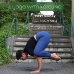 Karolina in crow pose in front of a flight of steps, outdoors, yoga class ad