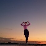 Dancer captured mid air hovering from Peridance at sunset