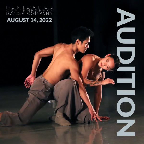 The image displays two dancers onstage.