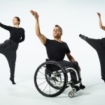 a photo of 3 dancers, one in a wheelchair, 2 jumping in the air. All 3 dancers have 1 arm in the air