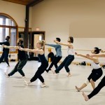 Group of dancers taking Limón technique class in a dance studio