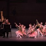 Students wearing pink tutus and the NYCB Orchestra perform at Family Saturdays presentation.