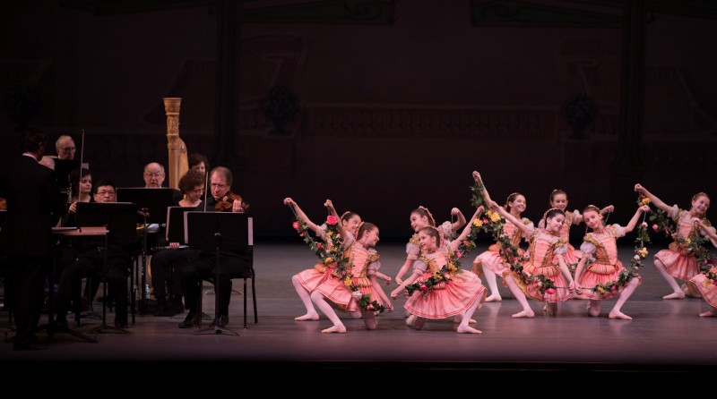 Students wearing pink tutus and the NYCB Orchestra perform at Family Saturdays presentation.