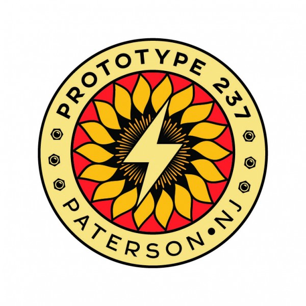 Circular logo with a sunflower and lightning bolt in the center and the words Prototype 237 around the edge