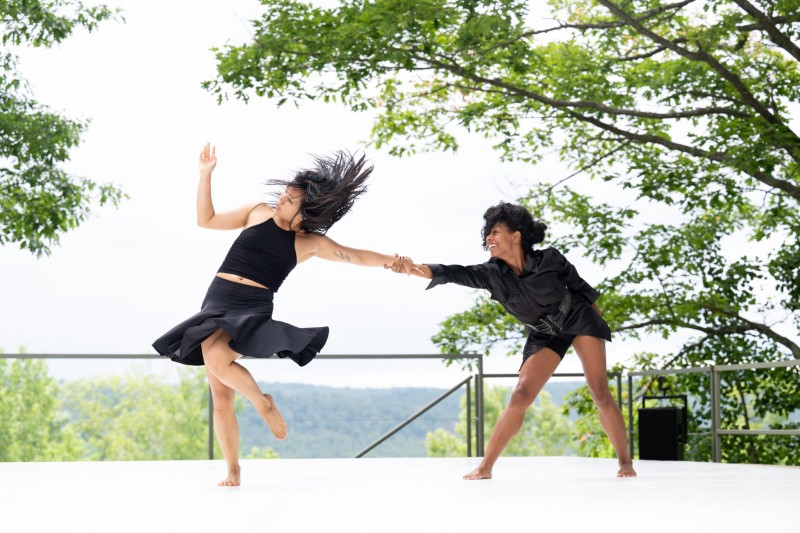 A photo of two dancers in Kyle Marshall's work on the Henry J. Leir Outdoor Stage at Jacob's Pillow Dance Festival.