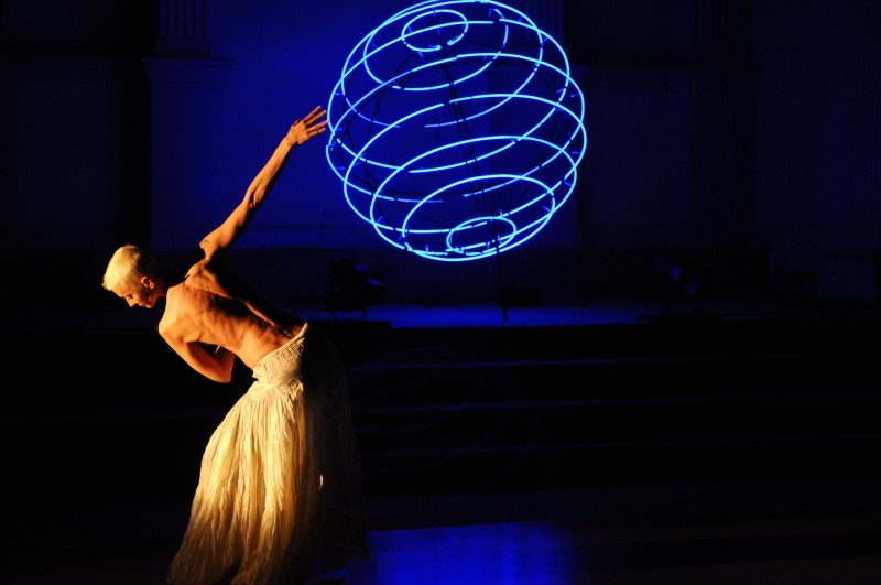 Dancer with large blue sphere