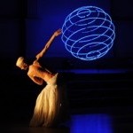 dancer silouhette with blue sphere