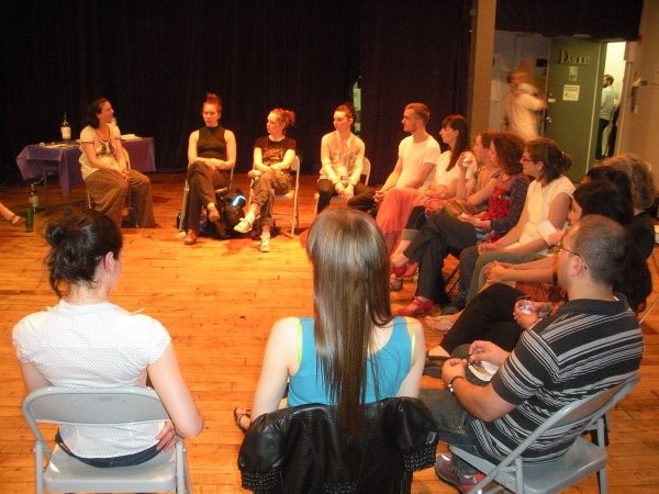 Artists and Audience members discussing the performance