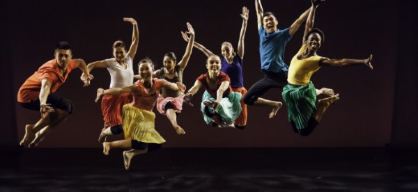 Photo of six dancers jumping in the air