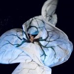 Jody Sperling in "American Elm" wearing a Loie Fuller style costume painted with tree limbs.