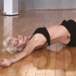 platinum dancer stretching on the floor