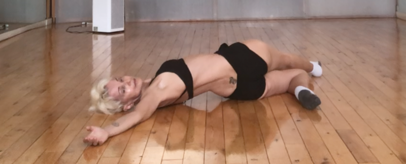 platinum dancer stretching on the floor