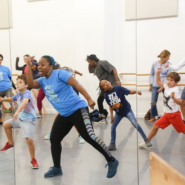 Teaching Artist leading a kids hip hop class at the Mark Morris Dance Center