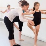 A teaching artist working with children at The School the Mark Morris Dance Center.